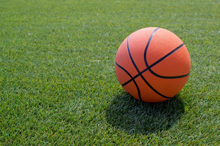 basketball ball on a soccer field on a summer dayの写真素材