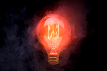 Incandescent lamp on a black backgroundの写真素材