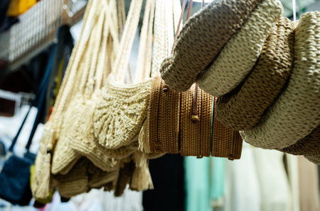 A bunch of handbags hanging on a rackの写真素材