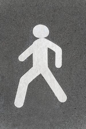 The sign of the pedestrian zone on the asphalt surface.の写真素材