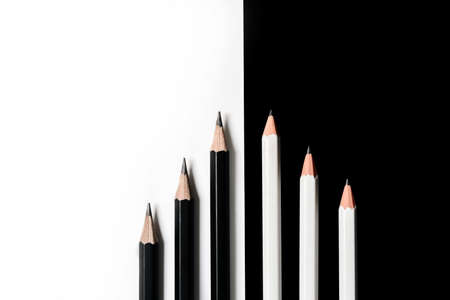 flat lay composition with white and black color cards. Pencils lie in a row on a black and white background with a copy space. Back to school conceptの写真素材