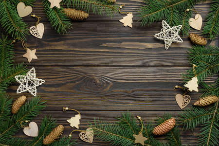 Christmas dyeing decorations from natural materials on a dark wooden background. Festive frame made...