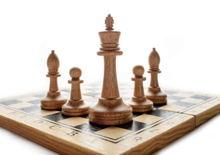 chess pieces on a board on a white background with copy space.の写真素材