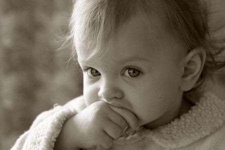 Portrait of a little baby in sepiaの写真素材