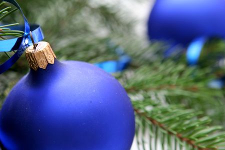Blue christmas bulbs on a white backgroundの写真素材