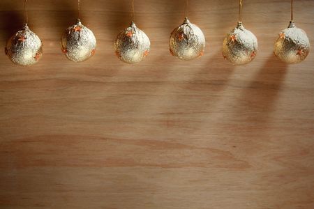 Christmas bulb on a wooden desk backgroundの写真素材