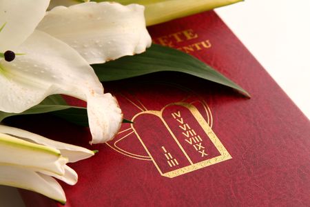 Bible and easter lilies on a white backgroundの写真素材