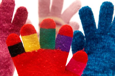 Colorful woolen gloves on a white backgroundの写真素材