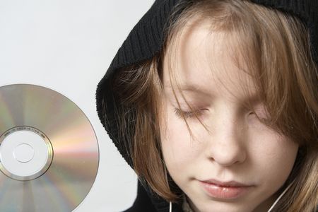 Young girl listening to the music with headphonesの写真素材