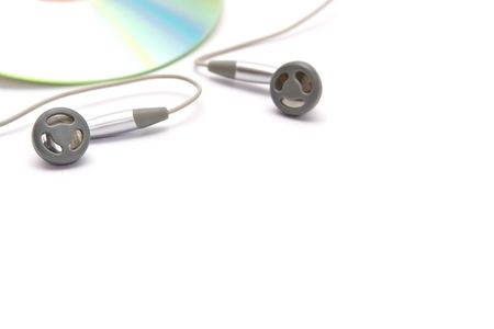 Grey and black earphones and compact discの写真素材