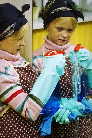 Little girl cleaning an old dirty houseの写真素材