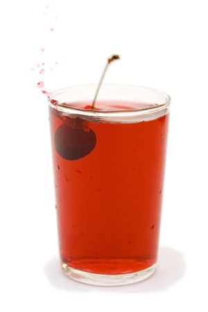 Cherry juice and fruit on a white backgroundの写真素材