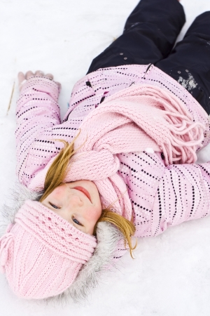 Children playing on the snowの写真素材