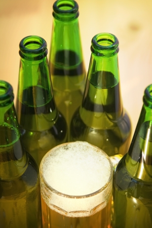 A mug of beer on wooden tableの写真素材