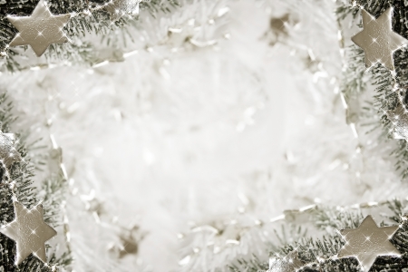 Silver sparkling stars on a white glistening backgroundの写真素材