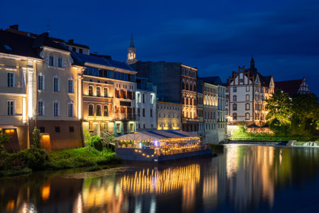 Night view of the illuminated city and its reflection in the water