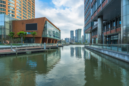 modern buildings at riverbank in shanghaiの写真素材