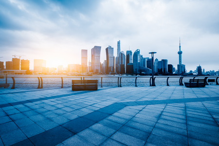 square of Shanghai financial district in China at dusk, blue toneの写真素材