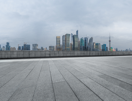 cityscape and skyline of shanghai from empty brick floorの写真素材