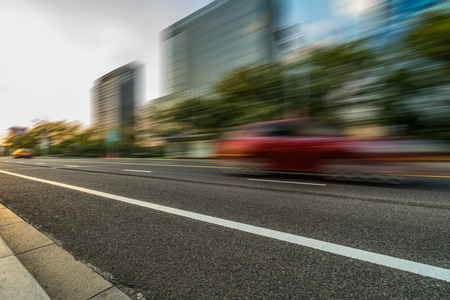 cars driving on inner city road of suzhou,china,asia.の写真素材