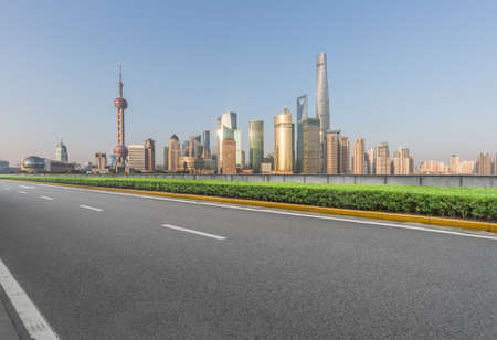 cityscape and skyline of shanghai from empty asphalt roadの写真素材
