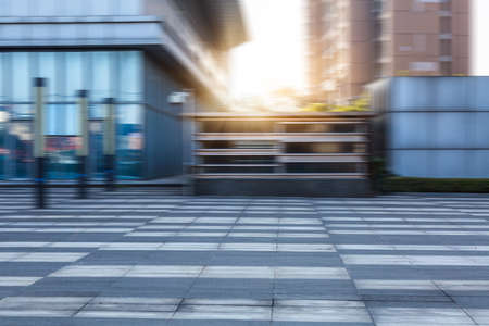 empty pavement and modern buildings in cityの写真素材