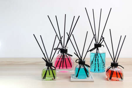 luxury glass aroma reed diffuser stick with blue , green , pink , red  colour oil are displayed on...