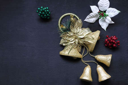photo background of christmas golden bell and white flower ornament decoration during winter christmas and new year celebration happy festival long holidayの写真素材