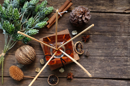 luxury aromatic scented reed diffuser or air freshener decorated on small wooden slat on wooden...