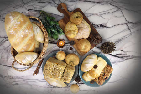 top view photo of various kind of homemade toast breads menu are on the white marble table during...