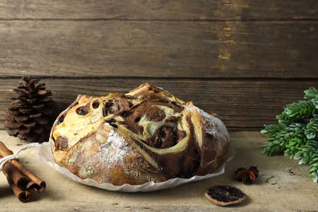 delicious homemade chocolate chips bread is on wooden table with pinecone and cinnamon sticks with...