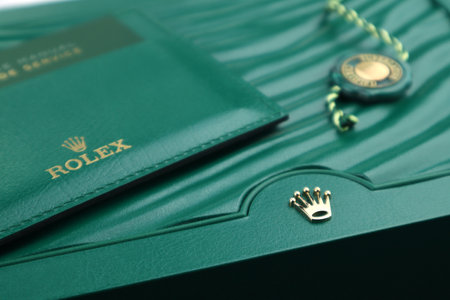 The Rolex package green leather box with golden logo is displayed  on the shelf in the luxury watch shopのeditorial素材