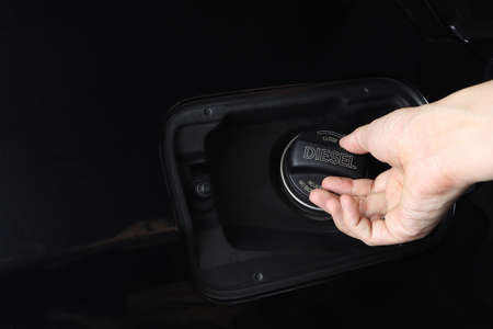 right hand opening car fuel tank cap cover of the black modern sports car after polished and coated....