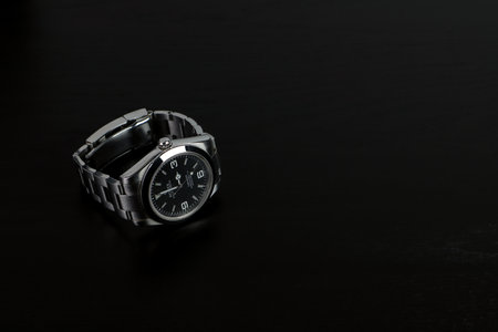 The Rolex vintage wristwatch model oyster perpetual explorer I 39 mm display on the black wooden table in the luxury watch shop exhibitionのeditorial素材