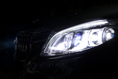 headlight led ray of black Benz c200 coupe AMG dynamic model sports luxury car in the dark garage