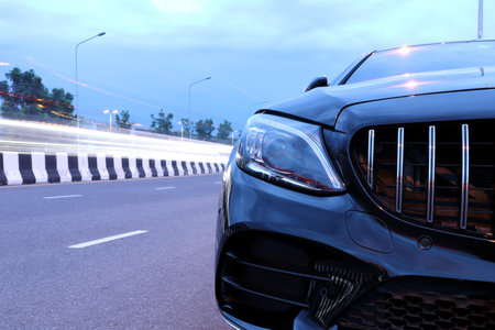 led headlight and chromium grille of luxury black color Mercedes Benz sports car, c class c200 coupe...