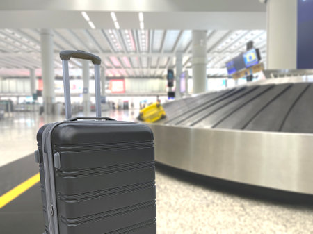 grey luggage is on floor with background of conveyor belt or carousel  in airport , delivering passengers luggages suitcases into arrival terminal hall before custom checkingの写真素材