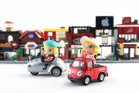 art toys Molly car car collection from Pop Mart blind box collectable cute toys Kenny Wong display on white shelf at Pop mart store in shopping mall during new release promotion Moのeditorial素材