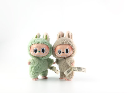 art toys Labubu key chain collection from Pop Mart blind box collectable cute toys display on white shelf background at Pop mart flagship store during new release promotion event lのeditorial素材