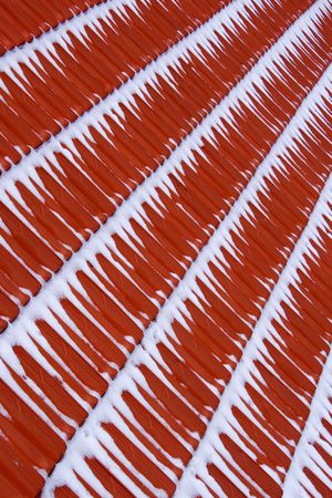 roof tiles covered with snowの写真素材