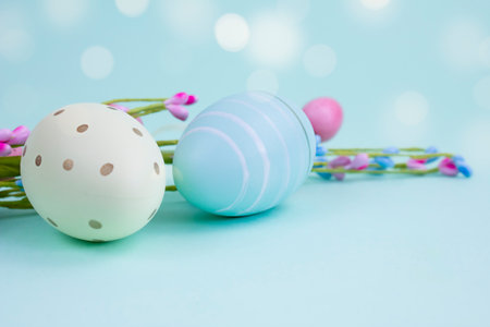 Decorative eggs on a blue background, copy space. Easter composition.