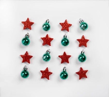 Pattern of red and green Christmas toys on a white background.の写真素材