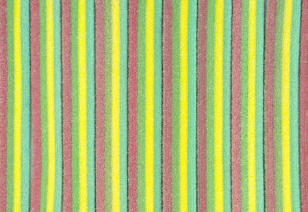 Marmalade stripes. Colorful rainbow background. Sugar gummy surface close up