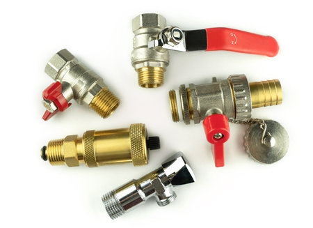 Plumbing details close-up on white isolated background. Bronze ball valve for water. Automatic check valve. Chrome plated tap, drain tapの写真素材