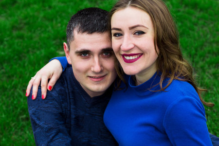 loving man and beautiful young woman outdoorsの写真素材