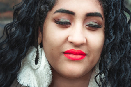Portrait of beautiful brazilian woman with bright makeup and red lips. Sensual sexy luxurious girl