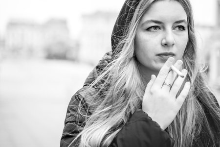 woman smoking cigarette addiction. portraitの写真素材