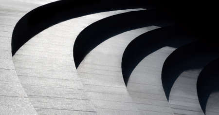 Architectural design of stairs. Curvilinear steps. Modern abstract geometric background. Black and...