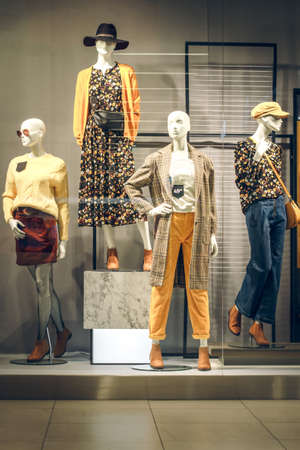POLAND, BYDGOSZCZ - November 26, 2019: Female mannequins in shop window. Standing women dummies show casual style collection of clothes in showcaseのeditorial素材