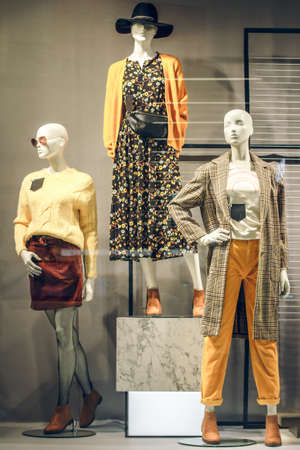 POLAND, BYDGOSZCZ - November 26, 2019: Female mannequins in shop window. Standing women dummies show casual style collection of clothes in showcaseのeditorial素材